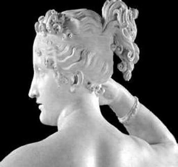 A white marble statue of a woman's head: smooth shading on the cheek and neck, small bright shiny spots, and dark folds